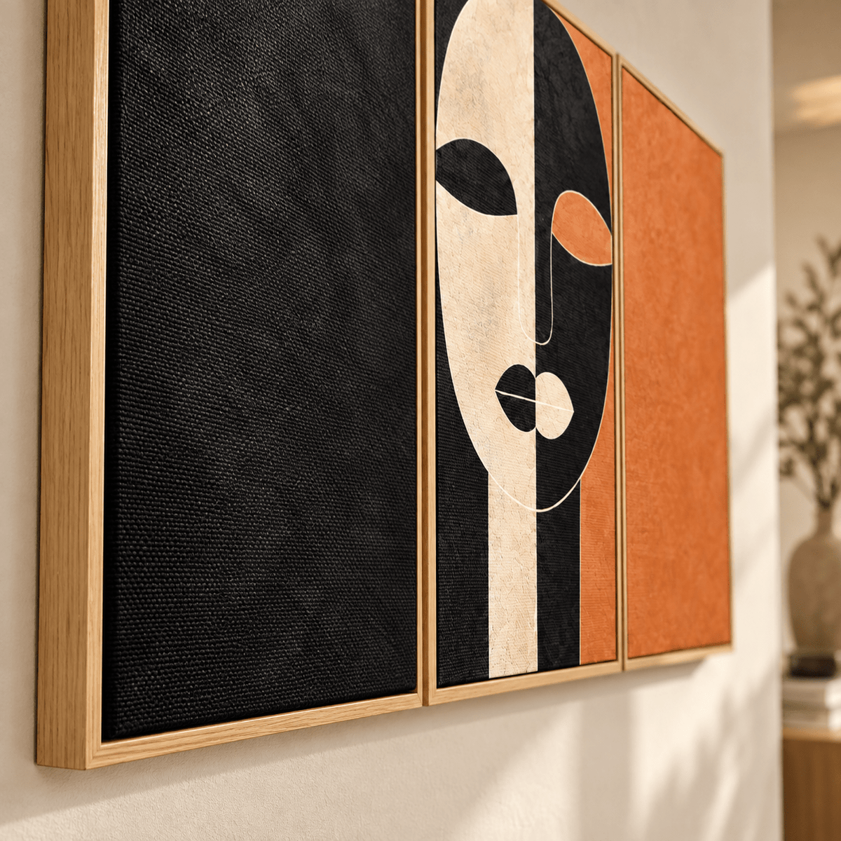 Close-up angled view of the Ochre Divide triptych wall art showing the textured canvas and floater frame edge by Rossetti Art